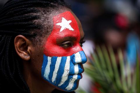 A Papuan student, her face painted with the West Papua flag, during a rally in Jakarta, Indonesia, 28 August 2019 (Andrew Gal/NurPhoto via Getty Images)