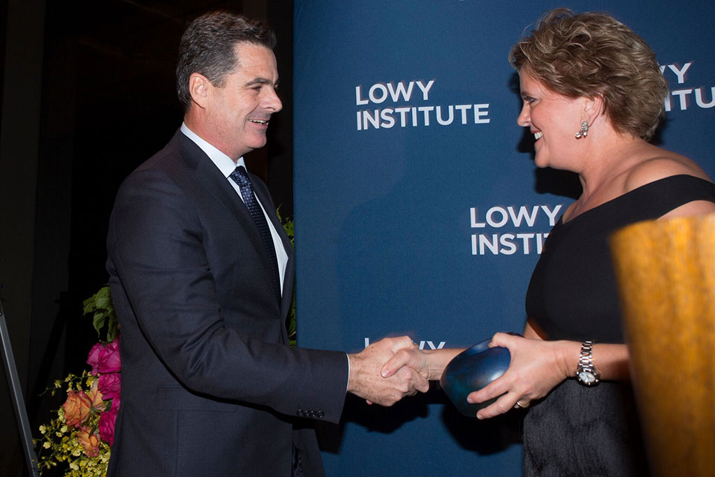 Matt Brown receiving the 2017 Lowy Institute Media Award from UK High Commissioner Menna Rawlings.