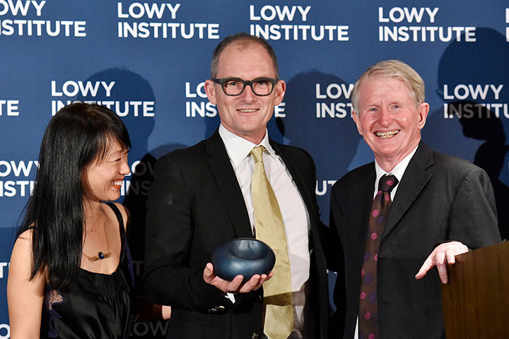 Evan Williams and Bernadine Lim receiving the 2018 Lowy Institute Media Award from veteran ABC correspondent Sean Dorney.