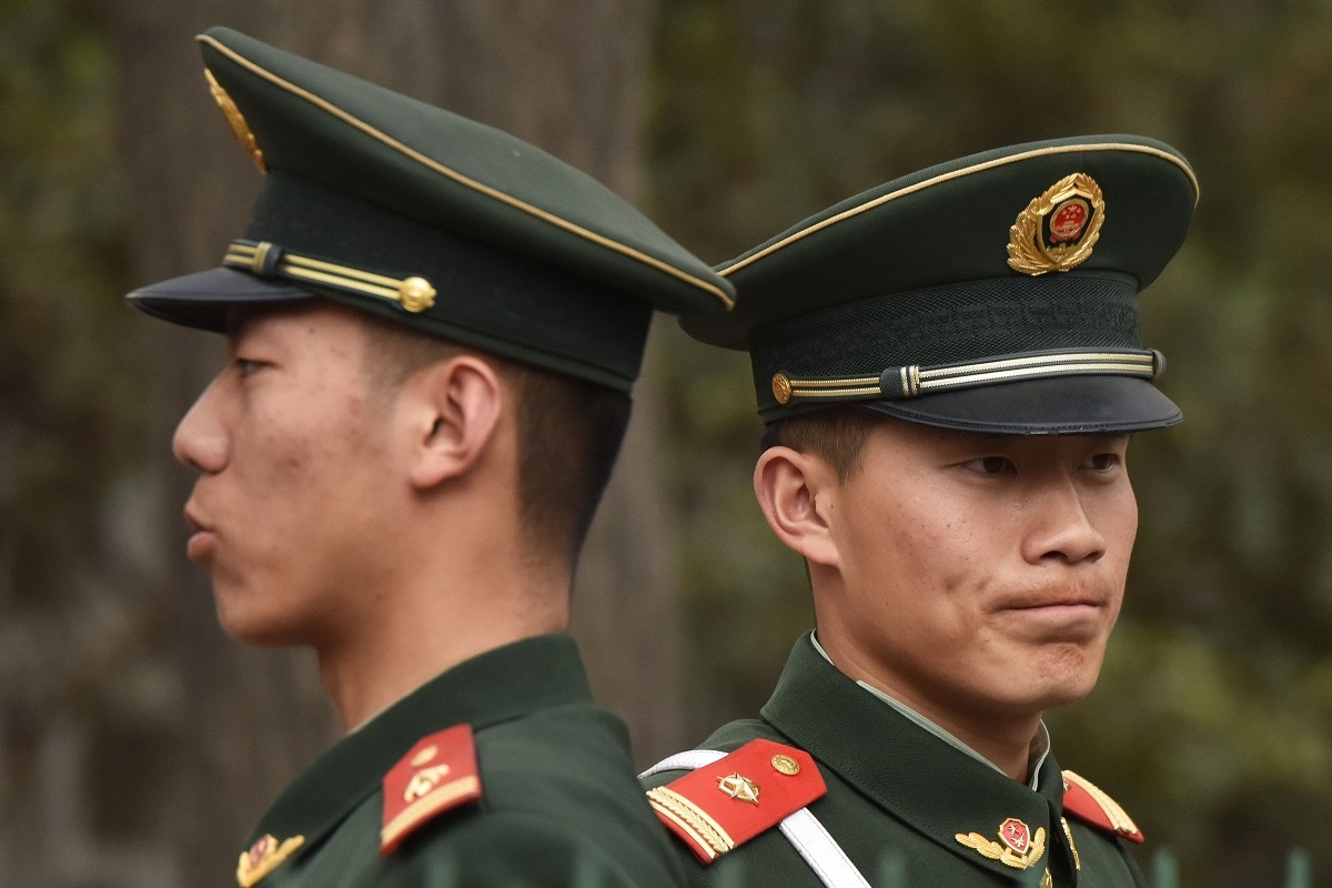 Chinese paramilitary police officers stand guard outside the North Korean embassy in Beijing on March 28, 2018. - North Korean leader Kim Jong Un was given a lavish welcome by Chinese President Xi Jinping during a secretive trip to Beijing as both sides seek to repair frayed ties before Pyongyang's landmark summits with Seoul and Washington. (Photo by Greg Baker / AFP) (Photo credit should read GREG BAKER/AFP via Getty Images)